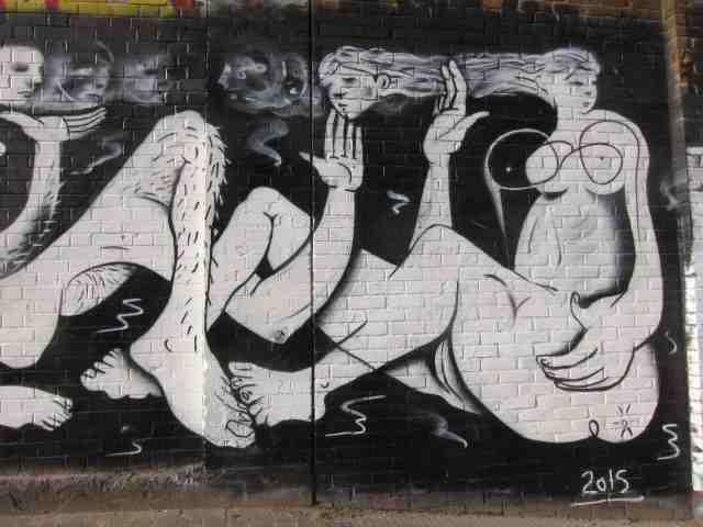 mural, two women and a hairly leg
